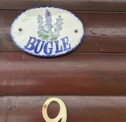 A sign with the name Bugle and house number 9 at Bugle in Saltburn-By-The-Sea
