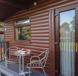 An outdoor patio with a table and chairs at Bugle Saltburn-By-The-Sea