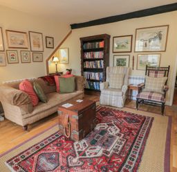 A living room with a sofa and armchairs at 4 Duck Street in Dorchester
