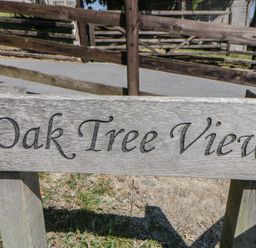 A wooden sign that reads Oak Tree View at Oak Tree View Nantmel near Rhayader