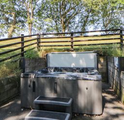 An outdoor area with a hot tub and steps at Oak Tree View Nantmel near Rhayader