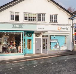 A street view of shops Rebel Rose boutique nursery shop and herdy gift shop at Fenty's in Bowness-On-Windermere