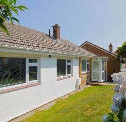 An outdoor view of a house with windows and a door at 65 Channel View Ilfracombe