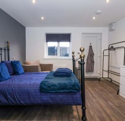 A bedroom with a bed and a window at Chalet 1 in Sherburn
