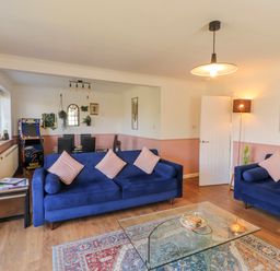A living room with sofas and an arcade machine at Lake View in Bowness-On-Windermere
