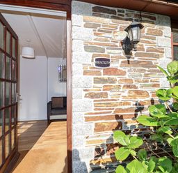 An entrance with a sofa visible in the background at Bracken Cottage St Tudy