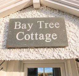 A nameplate that reads Bay Tree Cottage