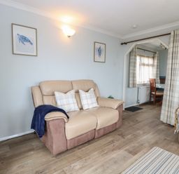 A living room with chairs and a table at Seaward in Trimingham
