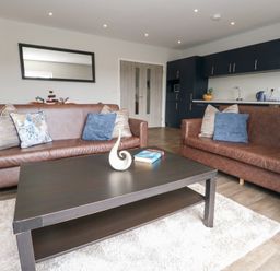 A living room with sofas and a coffee table at Durbyfield Nottington near Weymouth