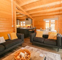 A living room with a sofa and coffee table at Howgills Retreat Gatebeck near Kirkby Lonsdale