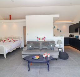 A living room with a bed and sofa at Ninky Nonk in Bristol