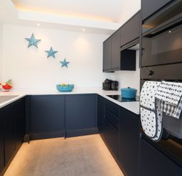 A kitchen with cabinets and appliances at Ninky Nonk in Bristol