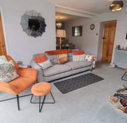 A living room with a sofa and armchairs at Country Retreat in Ponteland