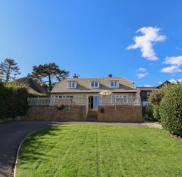 A house with steps and a front yard at Westhaven in Lyme Regis