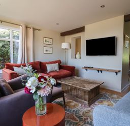 A living room with a sofa and coffee table at Westhaven in Lyme Regis