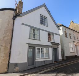 An exterior view of a house on a street at The Little Rose in Lyme Regis