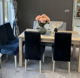 A dining room with a table and chairs at Loluke Lodge on The Lake, 5 Coniston Drive, Borwick near Carnforth