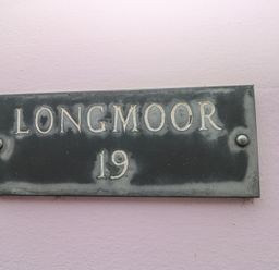 A nameplate with the text Longmoor 19