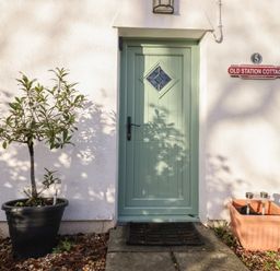An exterior view of a door and plant at Old Station Cottage in Blaenau Ffestiniog