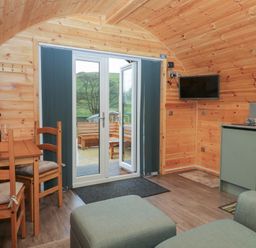 A living room with a dining area and kitchen at Beech in Ulverston