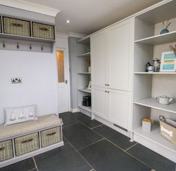 A mudroom with storage bench and shelves at Valley Pines in Valley