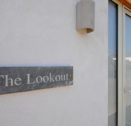 A sign indicating The Lookout at The Lookout in Polzeath