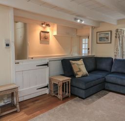 A living room with a sofa and side table at Wayside near Kingsbridge