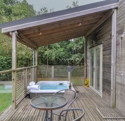 An outdoor area with a hot tub and seating at 3 Southern Place Dobwalls