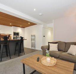 A living room with a sofa and coffee table at 24 Meadow Retreat in Dobwalls