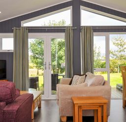 A living room with a sofa and dining table at 3 Horizon View, Dobwalls