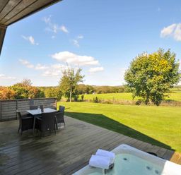 A garden with a hot tub and table set at 3 Horizon View Dobwalls