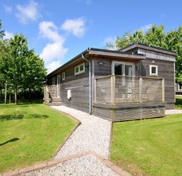 A house with a deck and garden at 12 Meadow Retreat in Dobwalls