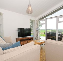 A living room with a sofa and television at 8 Horizon View in Dobwalls