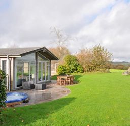 An outdoor area with a hot tub and furniture at 9 Horizon View Dobwalls