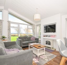 A living room with a sofa and table at 9 Horizon View in Dobwalls