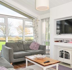 A living room with a sofa and television at 9 Horizon View in Dobwalls