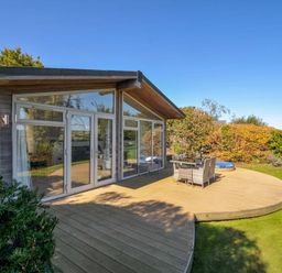A house with a decking area and outdoor furniture at 10 Horizon View, Dobwalls
