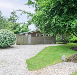 An outdoor area with a gravel driveway and wooden building at 15 Horizon View Dobwalls