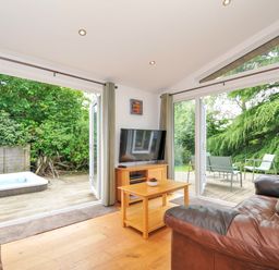 A living room with a TV and sofa at 15 Horizon View in Dobwalls