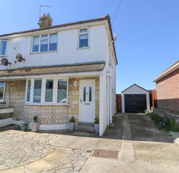 A semi detached house with a driveway leading to a detached garage at Lagoon View in Wyke