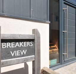 A sign and door entrance at Breakers View in Polzeath