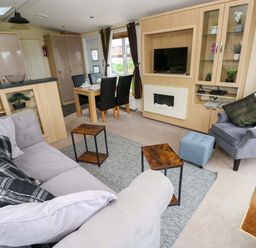 A living room with seating and dining area at Reef Retreat Little Haven