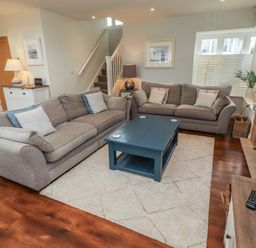 A living room with sofas and a coffee table at The Beach Hut Beadnell