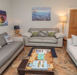 A living room with sofas and a coffee table at Number Seventeen Amble