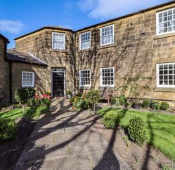 A house with a garden and pathway at Treetops, Alnwick