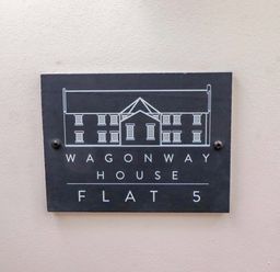 A sign for Wagonway House Flat 5