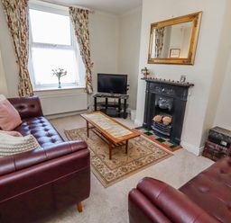 A living room with a sofa and table at Hardys House in Alnwick