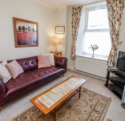 A living room with a sofa and television at Hardys House in Alnwick
