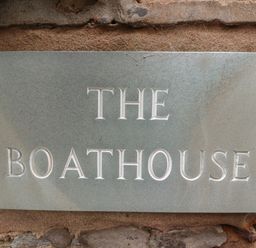 A stone plaque with the words THE BOATHOUSE carved into it at The Boathouse in Seahouses