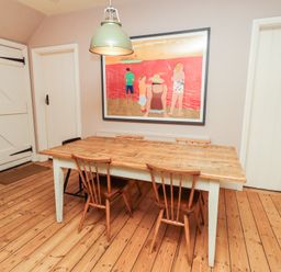 A dining room with a table and chairs at Armstrong Cottages No6 in Bamburgh